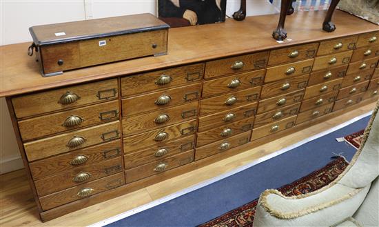 A late Victorian pine bank of forty two drawer